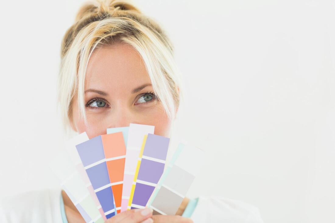 woman holding colors smiling